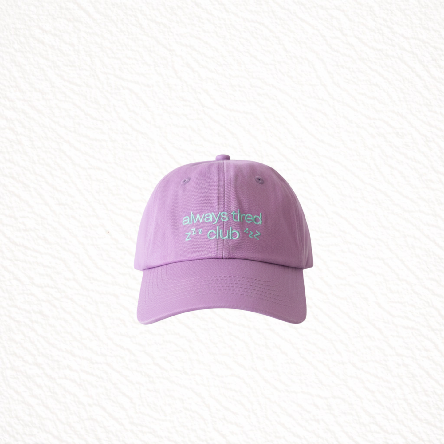 Purple cap with green text on a light gray background