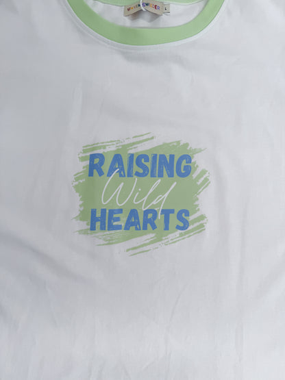 White t-shirt with 'Raising Wild Hearts' text and green border on a white background