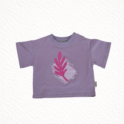Purple t-shirt with pink graphic on a white background