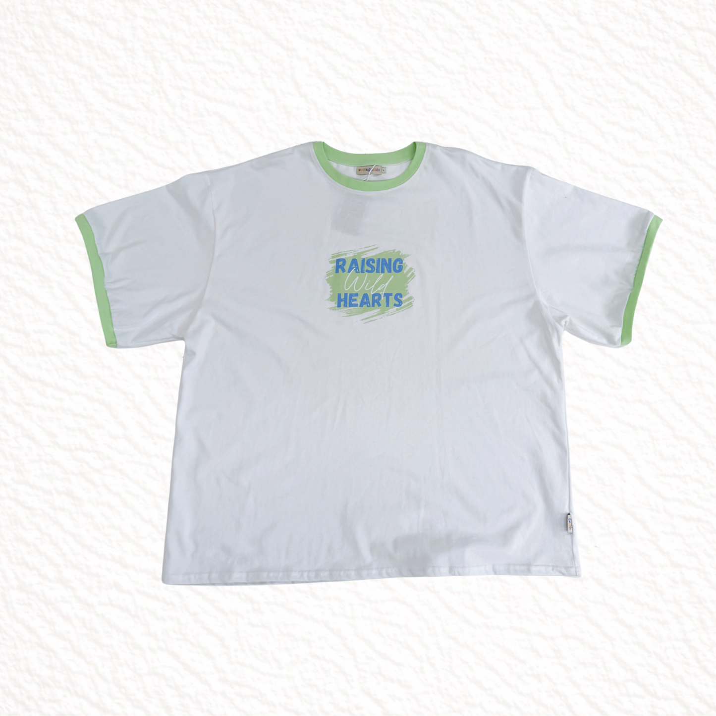 White t-shirt with green text and trim on a white background