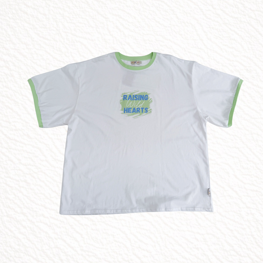 White t-shirt with green text and trim on a white background