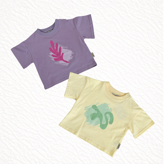 Two t-shirts, one purple and one yellow, with graphic designs on a white background