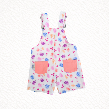 Short overalls with colorful floral pattern on a white background