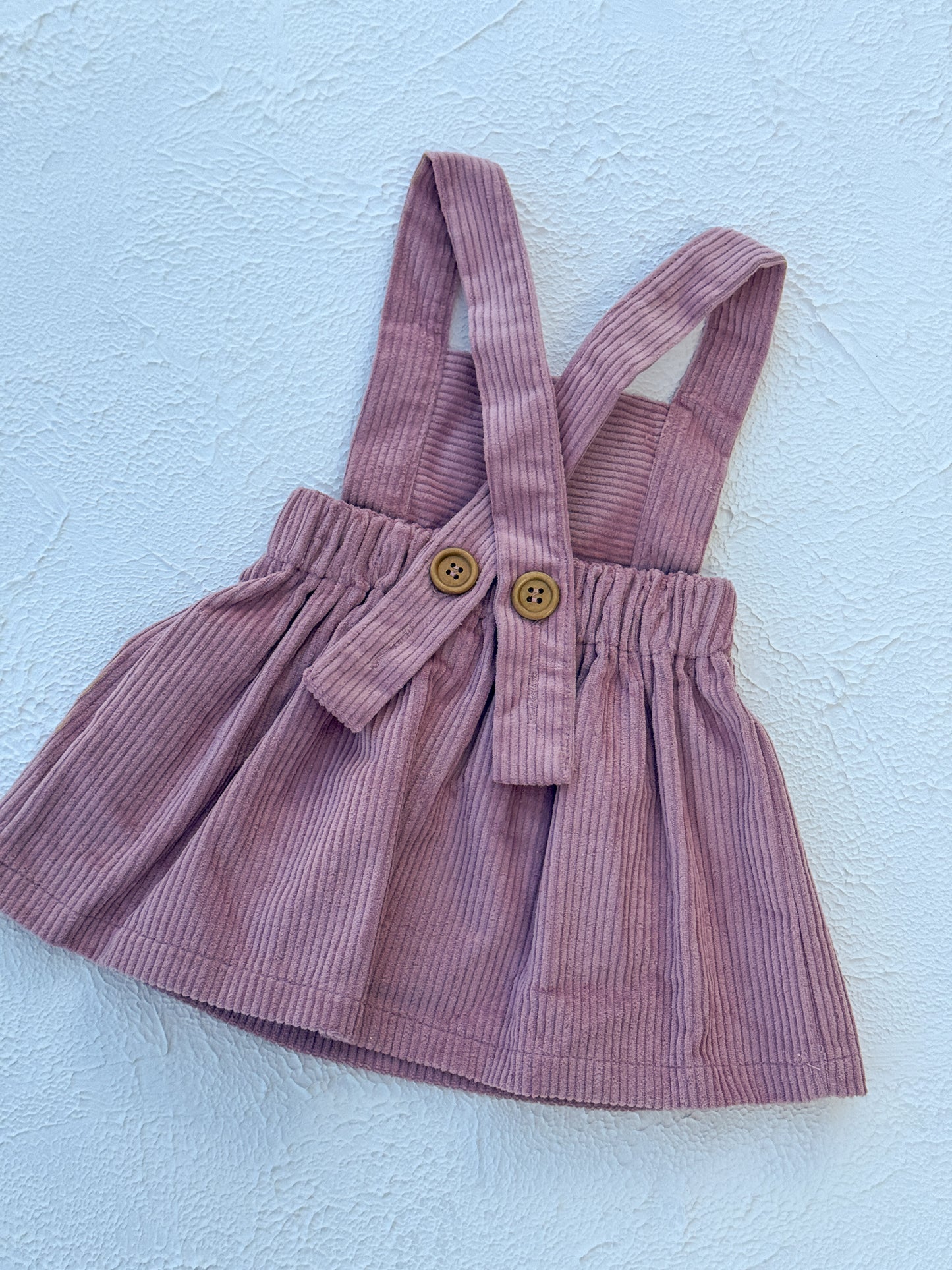 Pink dress on a light blue background