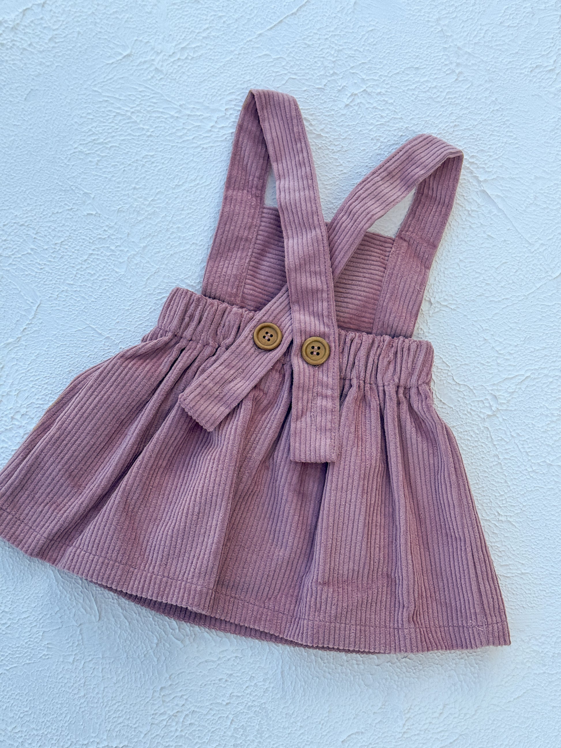 Pink dress on a light blue background