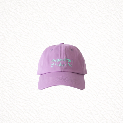 Purple cap with green text on a light gray background