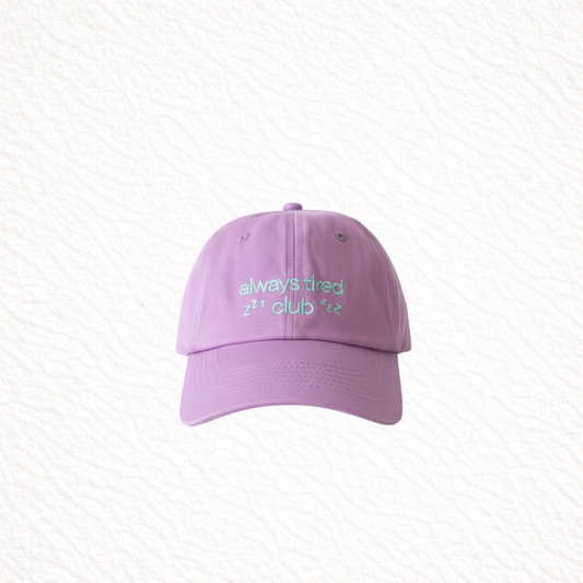 Purple cap with green text on a light gray background